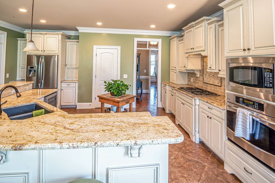 Sleek modern kitchen showcasing stainless steel appliances and elegant design.